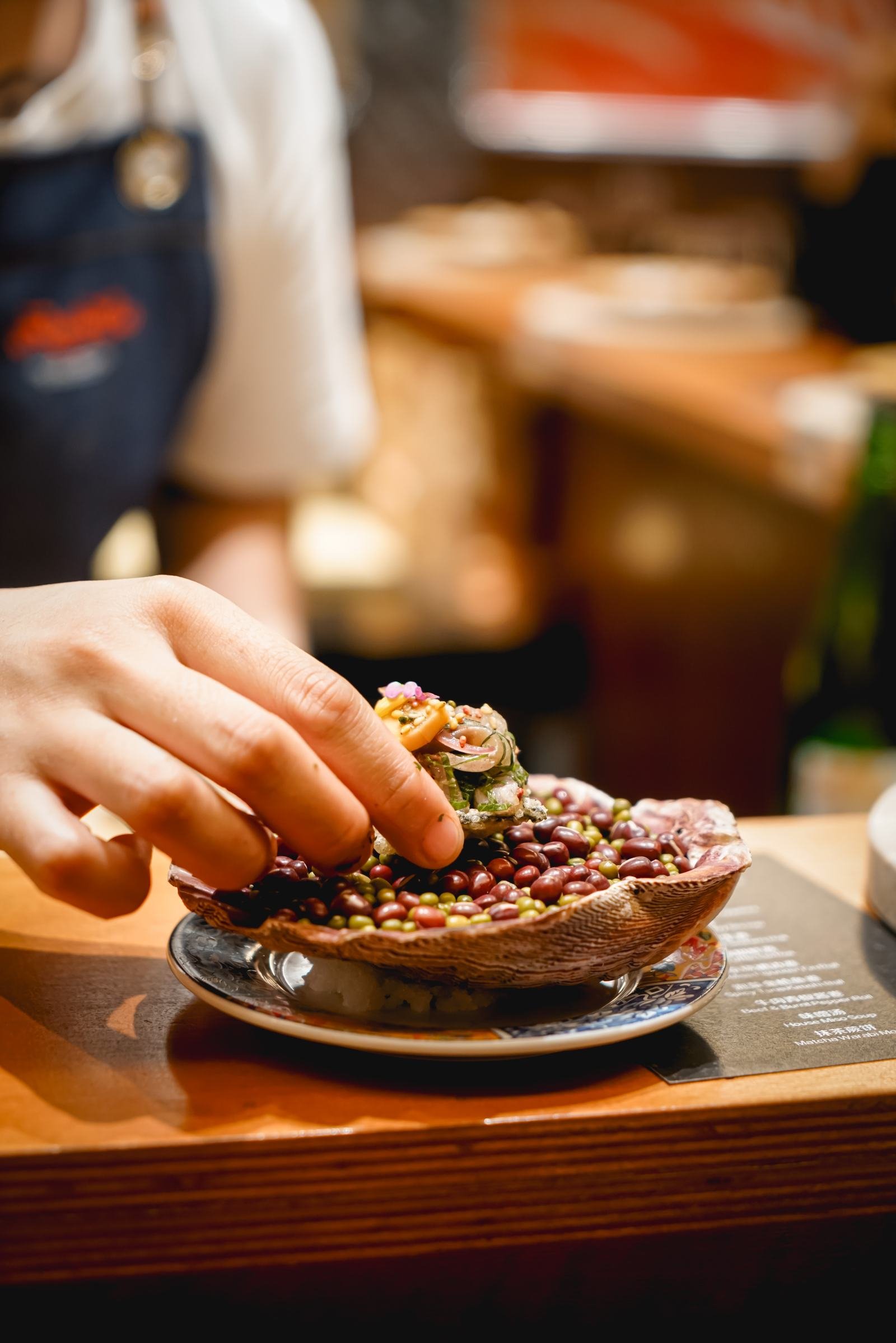 Ta-Ta bite being garnished at Roll & Co.