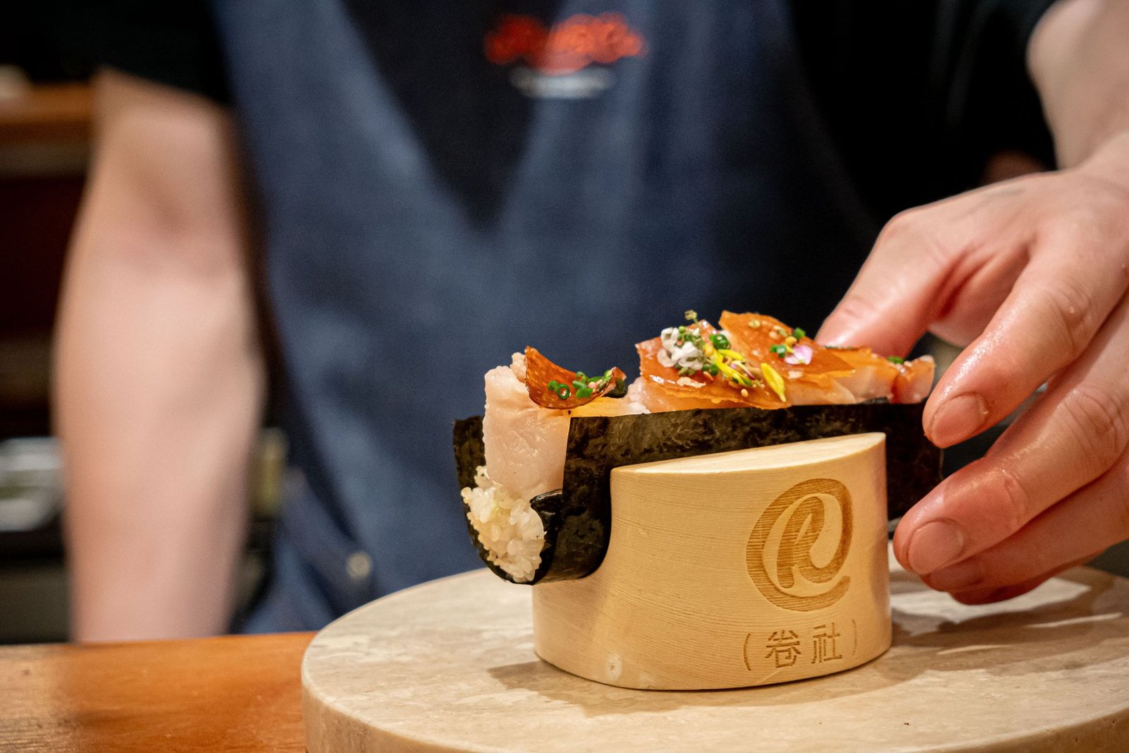 Hand roll being finished at the Roll & Co. counter